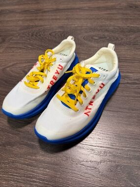 Men's Athletic Sneakers in White with Blue Soles and Yellow Laces